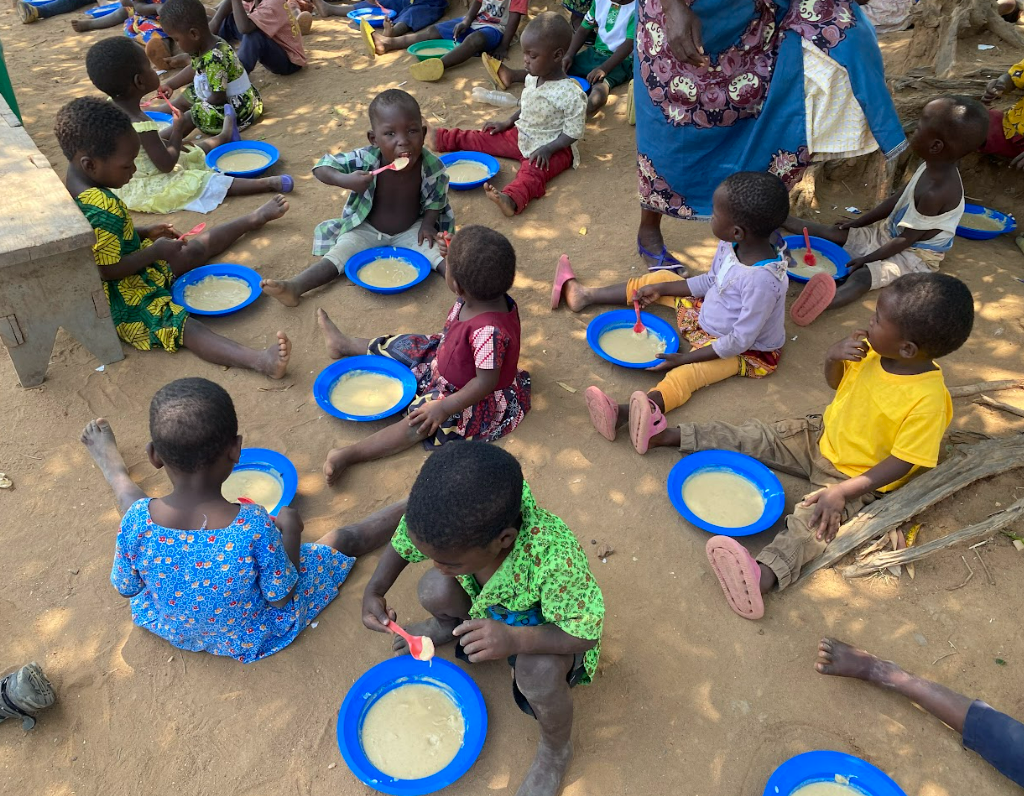 Children eating meals in Malawi